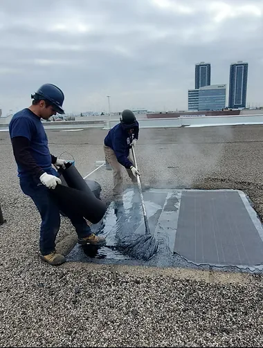 Roofing crew on a multi-residential building